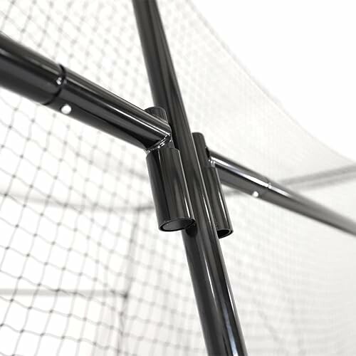 Close-up of a black metal frame with netting.